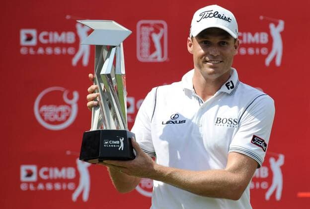 Oct. 28, 2012 - Kuala Lumpur, Malaysia - NICK WATNEY of the U.S. poses with the winners trophy after winning the CIMB Classic golf tournament at the Mines Resort and Golf Club in Kuala Lumpur. Golf 2012 - CIMB Classic - Day 4 - ZUMAz93