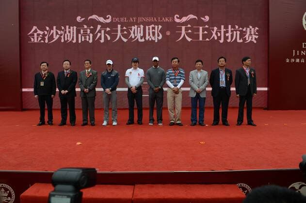 Golfers Tiger Woods of the United States, fifth right, Rory McIlroy of Northern Ireland, fourth left, and guests attend a ceremony for a golf exhibition match in Zhengzhou city, central Chinas Henan province, 29 October 2012.  20121029_30161