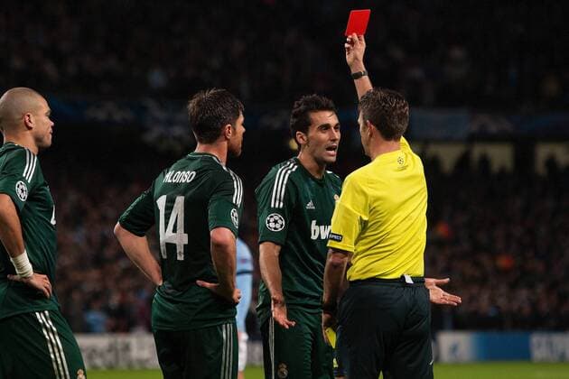 Football - 2012 2013 Champions League - Manchester City vs. Real Madrid Alvaro Arbeloa of Real Madrid is shown a red card at the Etihad Stadium 