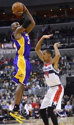 March 7, 2012 - Washington, DC, USA - Los Angeles Lakers shooting guard Kobe Bryant (24) shoots a three-pointer over Washington Wizards point guard Shaun Livingston (14) in the first half at the Verizon Center in Washington, D.C., Friday, December 14, 2012. Los Angeles Lakers vs Washington Wizards - ZUMAm67