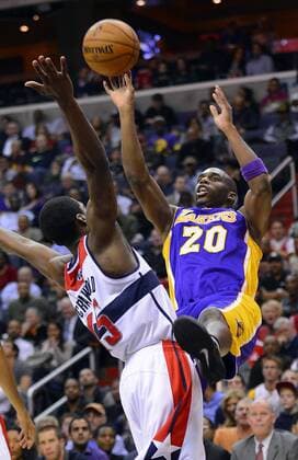 March 7, 2012 - Washington, DC, USA - Los Angeles Lakers shooting guard Jodie Meeks (20) fouls Washington Wizards shooting guard Jordan Crawford (15) on a shot attempt in the second quarter at the Verizon Center in Washington, D.C., Friday, December 14, 2012. Los Angeles Lakers vs Washington Wizards - ZUMAm67