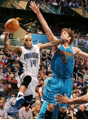 Dec. 26, 2012 - Orlando, Florida, U.S. - The Orlando Magic s JAMEER NELSON, left, tries to pass as the New Orleans Hornets ROBIN LOPEZ defends at the Amway Center. New Orleans won, 97-94. NBA Basketball Herren USA 2012 - Hornets Beat Magic 97-94 - ZUMAm67