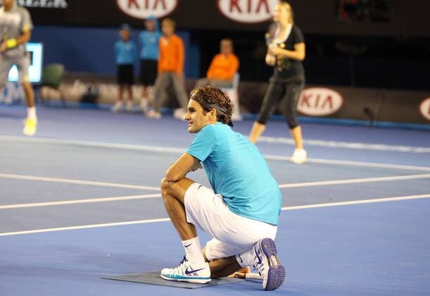 ballboy Roger Federer, SUI (back: Jo-Wilfried Tsonga, FRA, and Viktoria Azarenka, BLR) - during kids day exhibition show of the 2013 Tennis Australian Open in Melbourne, 12 01 2013 -