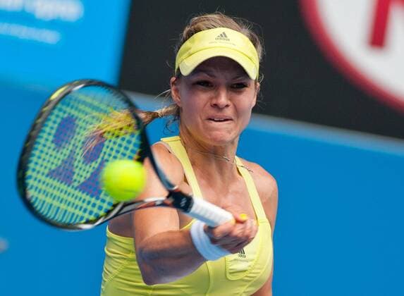 (130117) -- MELBOURNE, Jan. 17, 2013 (Xinhua) -- Russia s Maria Kirilenko hits a return during the women s singles second round match at 2013 Australian Open tennis tournament in Melbourne, Australia, Jan. 17, 2013. . (Xinhua Bai Xue) AUSTRALIA-MELBOURNE-TENNIS-WOMEN S SINGLES 