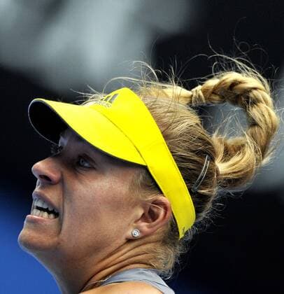 (130118) -- MELBOURNE, Jan. 18, 2013 (Xinhua) -- Angelique Kerber of Germany hits a return during her third round women s singles match on the fifth day of 2013 Australian Open tennis tournament in Melbourne, Australia, Jan. 18, 2013. 