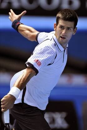 Novak Djokovic of Serbia hits a return during the men s singles third round match 2013 Australian Open tennis tournament in Melbourne, Australia, Jan. 17, 2013. Nov (Xinhua Chen Xiaowei) AUSTRALIA-MELBOURNE-TENNIS-MEN S SINGLES 