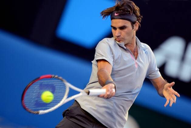 Roger Federer of Switzerland hits a return during their third round men s singles match at the Australian Open tennis tournament in Melbourne, Australia, Jan. 19, 2013. (Xinhua Chen Xiaowei) (lrz) AUSTRALIA-MELBOURNE-TENNIS-MEN S SINGLES 