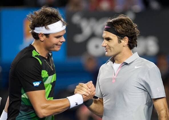 (130121) -- MELBOURNE, Jan. 21, 2013 (Xinhua) -- Roger Federer (R) of Switzerland greets Milos Raonic of Canada after their 4th round men s singles match at 2013 Australian Open tennis tournament in Melbourne, Australia, Jan. 21, 2013. Roger Federer won 3-0. (Xinhua Bai Xue) (jyc) AUSTRALIA-MELBOURNE-TENNIS-MEN S SINGLES 