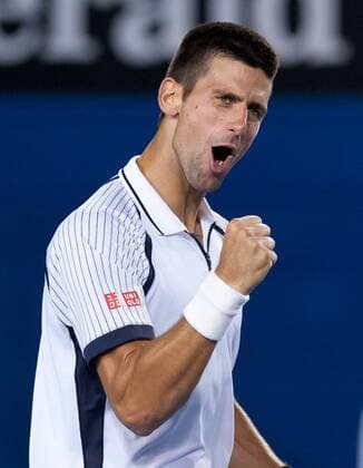 (130122) -- MELBOURNE, Jan. 22, 2013 (Xinhua) -- Novak Djokovic of Serbia reacts after winning his men s singles quarterfinals match against Tomas Berdych of Czech Republic at 2013 Australian Open tennis tournament in Melbourne, Australia, Jan. 22, 2013. Novak Djokovic won 3-1. (Xinhua Bai Xue) AUSTRALIA-MELBOURNE-TENNIS-MEN S SINGLES 