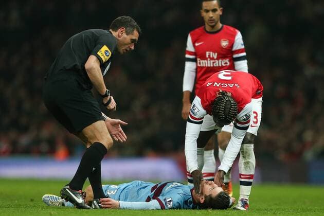 Football - 2012 2013 Premier League - Arsenal vs. West Ham United West Ham s Dan Potts is badly injured at the Emirates Stadium, London 