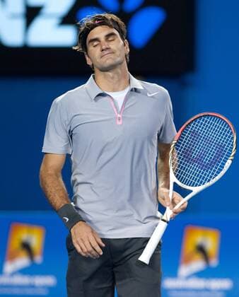 (130125) -- MELBOURNE, Jan. 25, 2013 (Xinhua) -- Roger Federer of Switzerland reacts during the men s singles semifinal match at the 2013 Australian Open tennis tournament in Melbourne, Australia, Jan. 25, 2013 (Xinhua Bai Xue) (jyc) AUSTRALIA-MELBOURNE-TENNIS-MEN S SINGLES-SEMIFINAL 
