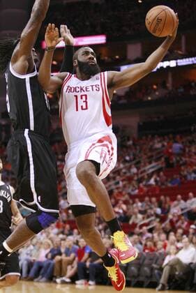 HOUSTON, Jan. 26, 2013 - Houston Rockets James Harden (R) drives to the basket during the NBA Basketball Herren USA basketball game against Brooklyn Nets in Houston, the United States, Jan. 26, 2013. Rockets won 119-106. (Xinhua Song Qiong) U.S.-HOUSTON-NBA-BASKETBALL-ROCKETS VS NETS 