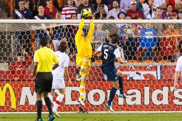 29 JANUARY, 2013: Canadian National Soccer GK Simon Thomas (22) jumps in the air to get the ball from U.S. National Soccer D Omar Gonzalez (5) during a friendly match at BBVA Compass Stadium in Houston, TX. SOCCER: JAN 29 International Friendly - Canada at USA Icon20130129006 EDITORIAL USE ONLY