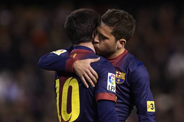 VALENCIA, SPAIN - FEBRUARY 03: Lionel Messi of FC Barcelona celebrates after scoring first goal for FC Barcelona with his team mates Jordi Alba of FC Barcelona during the Liga BBVA between Valencia CF and FC Barcelona at the Mestalla stadium on February 02, 2013 in Valencia, Spain. (Photo by Aitor Alcalde Colomer). 
