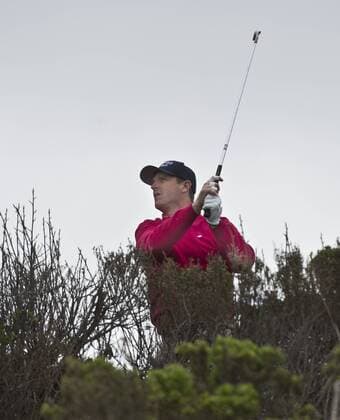 San Francisco 49ers Head Coach Jim Harbaugh tees off on the seventh hole at the Monterey Peninsula Country Club in the AT&T National Pro Am in Pebble Beach, California on February 7, 2013.  SXP20130200710