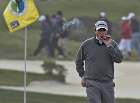 Wayne Gretzky puffs on the sixth green at the Monterey Peninsula Country Club in the AT&T National Pro Am in Pebble Beach, California on February 7, 2013.  SXP20130200714