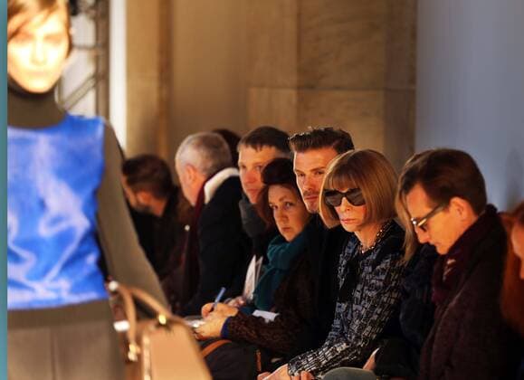 David Beckham sits next to Suzy Menkes and Anna Wintour to watch Victoria Beckham s show at New York Fashion Week for Autumn Winter 2013 , Sunday, 10th February 2013. Photo by: Stephen Lock i-Images StephenxLock i-Images  SLK