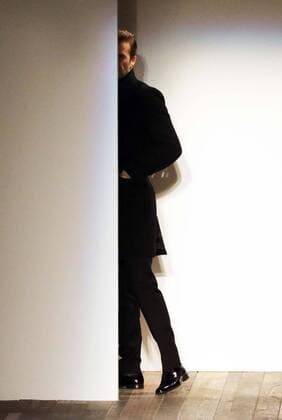 David Beckham takes a sneak look from backstage before the start of Victoria Beckham s show at New York Fashion Week for Autumn Winter 2013 , Sunday, 10th February 2013. Photo by: Stephen Lock i-Images StephenxLock i-Images  SLK