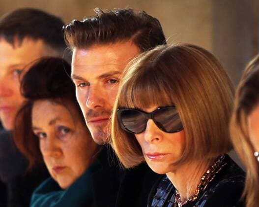David Beckham sits next to Suzy Menkes and Anna Wintour to watch Victoria Beckham s show at New York Fashion Week for Autumn Winter 2013 , Sunday, 10th February 2013. Photo by: Stephen Lock i-Images StephenxLock i-Images  SLK