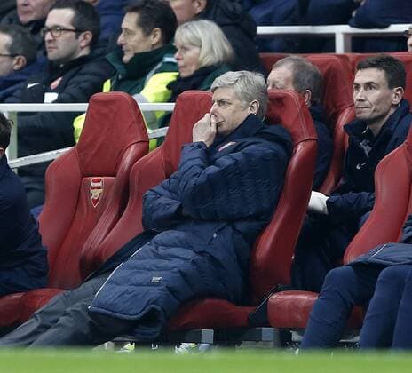 Arsenal s Arsene Wenger looks on dejected..Arsenal v Bayern Munich - Champions League Second Round, First Leg- Emirates Stadium, London- 19 02 13 - Picture David Klein Sportimage EDITORIAL USE ONLY. No use with unauthorised audio, video, data, fixture lists, club league logos or live services. Online in-match use limited to 120 images, no video emulation. No use in betting, games or single club league player publications.