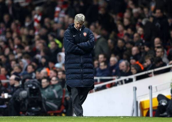 Arsenal s Arsene Wenger looks on dejected..Arsenal v Bayern Munich - Champions League Second Round, First Leg- Emirates Stadium, London- 19 02 13 - Picture David Klein Sportimage EDITORIAL USE ONLY. No use with unauthorised audio, video, data, fixture lists, club league logos or live services. Online in-match use limited to 120 images, no video emulation. No use in betting, games or single club league player publications.