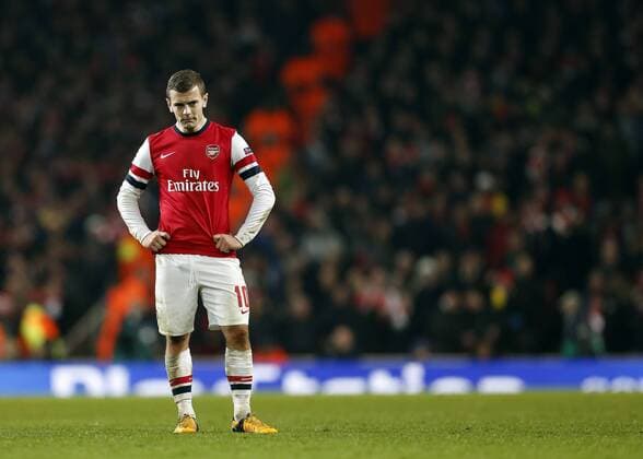 Arsenal s Jack Wilshere looks on dejected after going 3-1 down..Arsenal v Bayern Munich - Champions League Second Round, First Leg- Emirates Stadium, London- 19 02 13 - Picture David Klein Sportimage EDITORIAL USE ONLY. No use with unauthorised audio, video, data, fixture lists, club league logos or live services. Online in-match use limited to 120 images, no video emulation. No use in betting, games or single club league player publications.