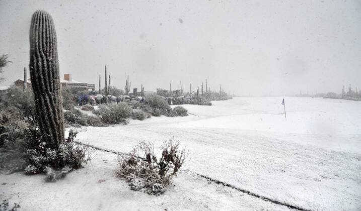 Snow covers the course after play was suspended during the first round of the Accenture World Golf Championship at The Golf Club at Dove Mountain in Marana, Arizona February 20, 2013.  PXP2013022013