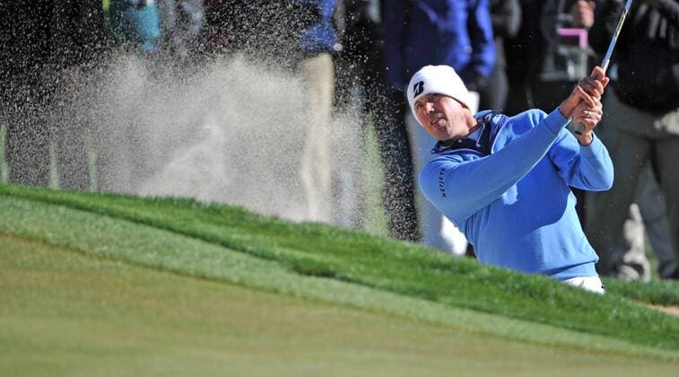 Matt Kuchar hits out of a sand trap on the fifteenth hole on his way to winning the Accenture World Golf Championship at The Golf Club at Dove Mountain in Marana, Arizona February 24, 2013. Kuchar defeated Hunter Mahan.  PXP2013022415