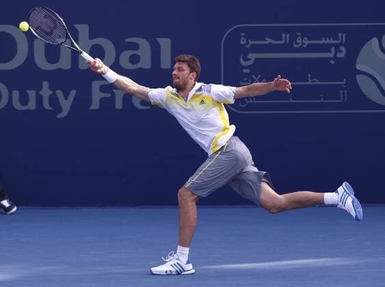 Dubai Tennis Championships 2013, ATP Tennis Herren Tennis Turnier,International Series,Dubai Tennis Stadium, U.A.E.,Daniel Brands (GER),Aktion,Einzelbild,Ganzkoerper,Querformat,