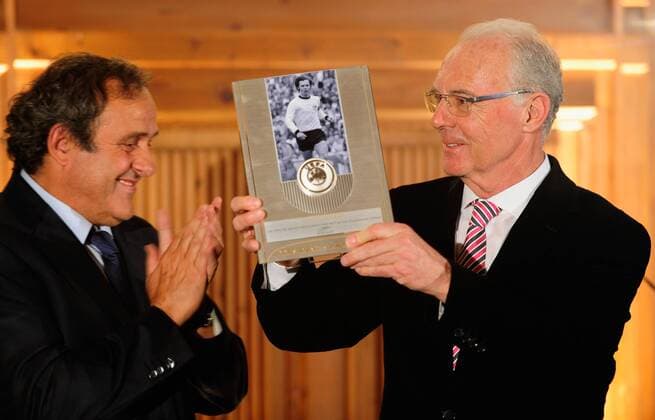 MUNICH, GERMANY - FEBRUARY 27: Franz Beckenbauer (R) poses with his award next to Michel Platini, UEFA preseident during the UEFA President s Award at Suedtiroler Stuben on February 27, 2013 in Munich, Germany. Local Caption Franz Beckenbauer; Michel Platini - Poolfoto