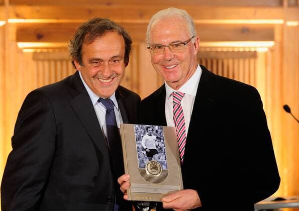 MUNICH, GERMANY - FEBRUARY 27: Franz Beckenbauer (R) poses with his award next to Michel Platini, UEFA preseident during the UEFA President s Award at Suedtiroler Stuben on February 27, 2013 in Munich, Germany. Local Caption Franz Beckenbauer; Michel Platini - Poolfoto