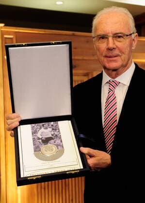 MUNICH, GERMANY - FEBRUARY 27: Franz Beckenbauer poses with his award during the UEFA President s Award at Suedtiroler Stuben on February 27, 2013 in Munich, Germany. Local Caption Franz Beckenbauer - Poolfoto