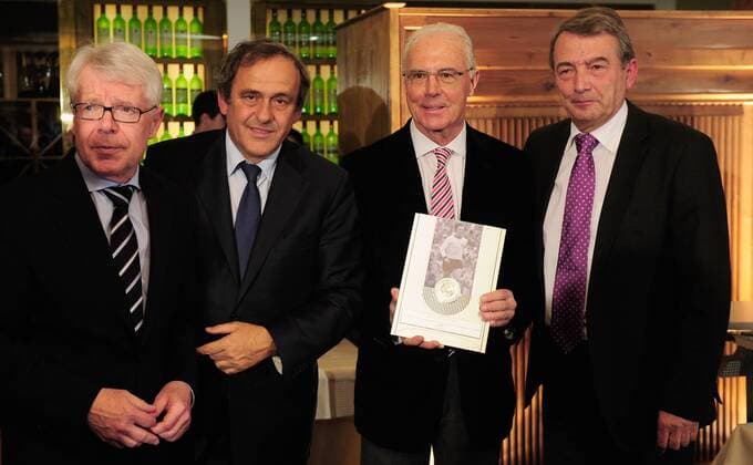 MUNICH, GERMANY - FEBRUARY 27: League President Reinhard Rauball (L-R), UEFA president Michel Platini, Franz Beckenbauer and DFB president Wolfgang Niersbach pose with the award during the UEFA President s Award at Suedtiroler Stuben on February 27, 2013 in Munich, Germany. Local Caption Reinhard Rauball; Michel Platini; Franz Beckenbauer; Wolfgang Niersbach - Poolfoto