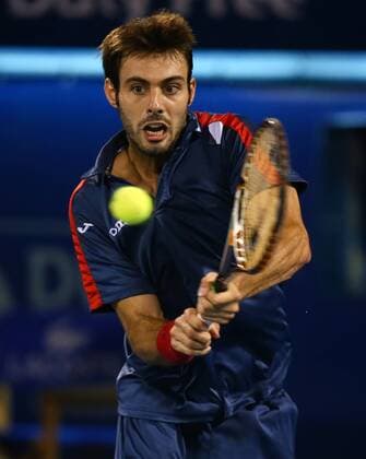 Dubai Tennis Championships 2013, ATP Tennis Herren Tennis Turnier,International Series,Dubai Tennis Stadium, U.A.E.,Marcel Granollers (ESP)Aktion,Einzelbild,Halbkoerper,Hochformat,