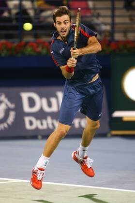 Dubai Tennis Championships 2013, ATP Tennis Herren Tennis Turnier,International Series,Dubai Tennis Stadium, U.A.E.,Marcel Granollers (ESP)Aktion,Einzelbild,Ganzkoerper,Hochformat,