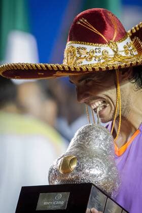 Spain s Rafael Nadal poses with his trophy during the awarding ceremony after the men s singles final match at the Mexican Open Tennis Tournament in Acapulco, State of Guerrero, Mexico, on Mar. 2, 2013. (Xinhua Pedro Mera) MEXICO-ACAPULCO-TENNIS-OPEN 
