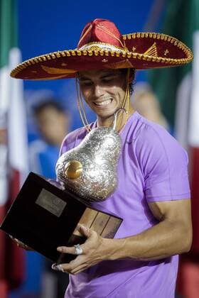 Spain s Rafael Nadal poses with his trophy during the awarding ceremony after the men s singles final match at the Mexican Open Tennis Tournament in Acapulco, State of Guerrero, Mexico, on Mar. 2, 2013. (Xinhua Pedro Mera) MEXICO-ACAPULCO-TENNIS-OPEN 