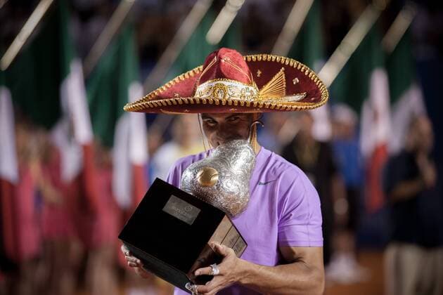 Spain s Rafael Nadal poses with his trophy during the awarding ceremony after the men s singles final match at the Mexican Open Tennis Tournament in Acapulco, State of Guerrero, Mexico, on Mar. 2, 2013. (Xinhua Pedro Mera) MEXICO-ACAPULCO-TENNIS-OPEN 