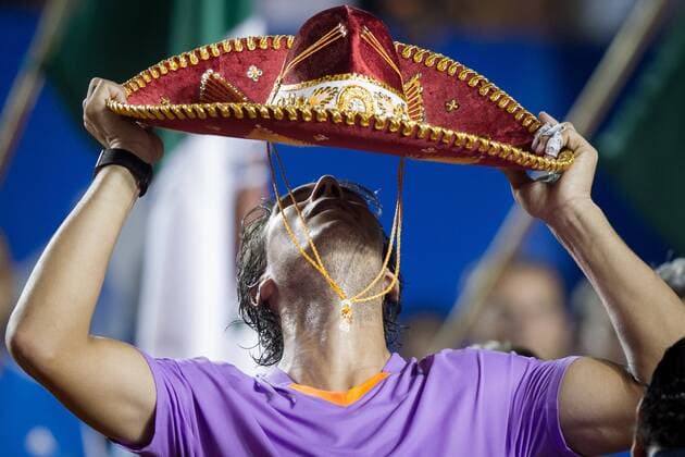 Rafael Nadal of Spain wears a sombrero after the men s singles final match at the Mexican Open Tennis Tournament held in Acapulco, State of Guerrero, Mexico, on Mar. 2, 2013. (Xinhua Pedro Mera) MEXICO-ACAPULCO-TENNIS-OPEN 