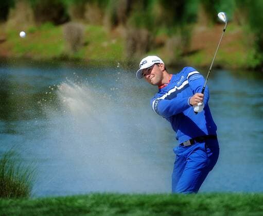 March 3, 2013 - Palm Beach Gardens, FL, USA - Luke Guthrie hits out of a greenside bunker on the third hole, while playing with the eventual winner, Michael Thompson, during the final round of the Honda Classic at the PGA Golf Herren National Resort and Spa in Palm Beach Gardens, Florida, Sunday, March 3, 2013. Honda Classic 2013 - ZUMAm67