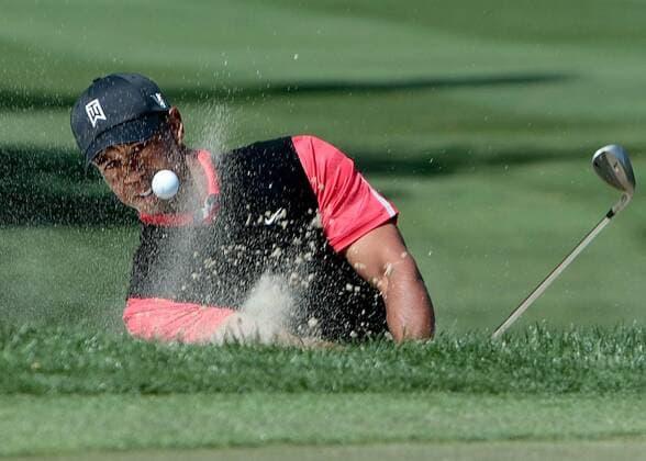 March 3, 2013 - Palm Beach Gardens, Florida, U.S. - TIGER WOODS hits out a bunker at the 11th green during final round action of The Honda Classic Sunday afternoon at PGA Golf Herren National Resort. Woods started the final round eight shots back and closed with a 74 - his first time since the Masters last year that he failed to break par in any round of a 72-hole tournament. PGA Golf Herren 2013 - Thompson Wins Honda Classic - ZUMAp77