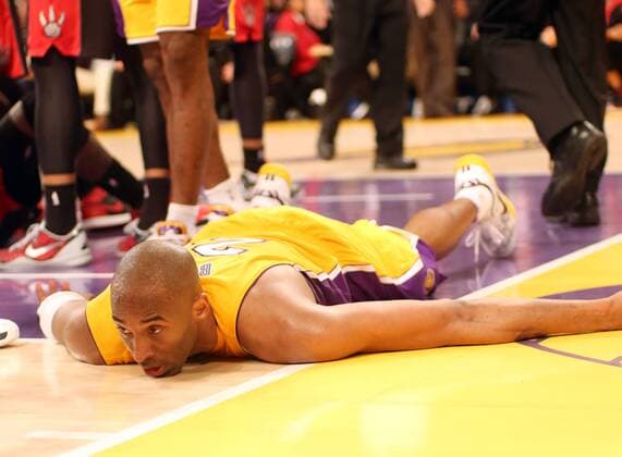 March 8, 2013 - Los Angeles, California, U.S - Lakers guard Kobe Bryant lays out following a hard foul as the Los Angeles Lakers defeat the visiting Toronto Raptors 118-116 on Friday, March8, 2013, at the Staples Center in Los Angeles, California. Lakers defeat Raptors 118-116  - ZUMAp12