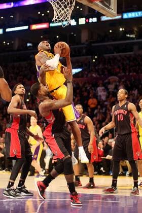 March 8, 2013 - Los Angeles, California, U.S - Lakers guard Kobe Bryant gets fouled by Raptors reserve Amir Johnson on this drive to the basket as the Los Angeles Lakers defeat the visiting Toronto Raptors 118-116 on Friday, March8, 2013, at the Staples Center in Los Angeles, California. Lakers defeat Raptors 118-116  - ZUMAp12