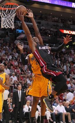 March 10, 2013 - Miami, FL, USA - Dwyane Wade of the Miami Heat goes to the basket against Ian Mahinmi of the Indiana Pacers during the second quarter at the AmericanAirlines Arena in Miami, Florida, Sunday, March 10, 2013. Miami defeated Indiana, 105-91. Heat vs. Pacers - ZUMAm67