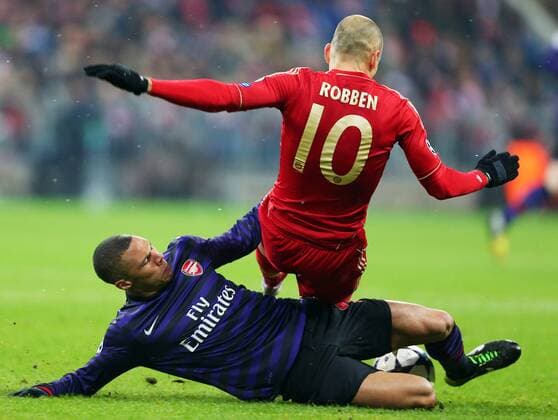 FUSSBALL - CL, Bayern vs Arsenal MUENCHEN,DEUTSCHLAND,13.MAR.13 - FUSSBALL - UEFA Champions League, Achtelfinale, FC Bayern München vs Arsenal FC. Bild zeigt Kieran Gibbs (Arsenal) und Arjen Robben (Bayern). 