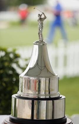 March 20, 2013 - Orlando, FL, USA - The championship trophy rests on a table as golfers warm up on the practice green behind during the Pro-Am tournament of the Arnold Palmer Invitational at the Bay Hill Club & Lodge in Orlando, Florida, Wednesday, March 20, 2013. Pro-Am tournament of the Arnold Palmer Invitational - ZUMAm67
