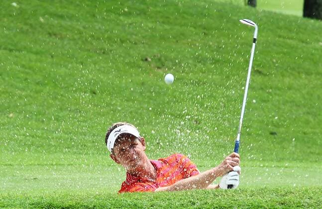 21.03.2013 Kuala Lumpur, Malaysia. Luke Donald of England hits his bunker shot on the 15th hole during day one of the Maybank Malaysia Open Golf Tournament at the Kuala Lumpur Golf and Country Club. xMegatxFirdausx  ActionPlus11389248