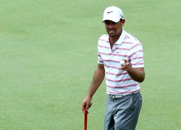 21.03.2013 Kuala Lumpur, Malaysia. Charl Schwartzel of South Africa reacts after make a birdie putts on the 9th hole during day one of the the Maybank Malaysia Open Golf Tournament at the Kuala Lumpur Golf and Country Club. xMegatxFirdausx  ActionPlus11389254
