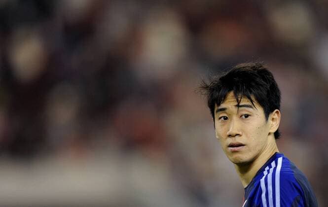 (130323) -- DOHA, March 22, 2013 (Xinhua) -- Kagawa Shinji of Japan reacts during the international friendly match between Japan and Canada at Khalifa Stadium in Doha, Qatar, on March 22, 2013. Japan won 2-1. (Xinhua Chen Shaojin) (lm) QATAR-DOHA-SOCCER-INTERNATIONAL FRIENDLY-JPN VS. CAN 
