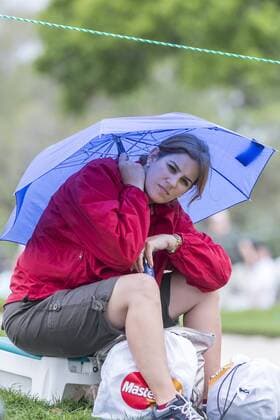 March 24, 2013: A spectator sits under an umbrella near the 9th green after the horn sounded for delay of game during final round golf action of the Arnold Palmer Invitational presented by Mastercard held at Arnold Palmer s Bay Hill Club & Lodge in Orlando, FL PGA Golf Herren 2013: Arnold Palmer Invitational MAR 24 - ZUMAcg2